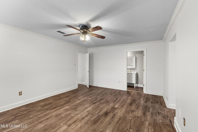 125 Lakeview Dr, Canton, MS 39046 - unfurnished bedroom featuring dark wood-type flooring, ornamental molding, baseboards, ensuite bath, and ceiling fan
