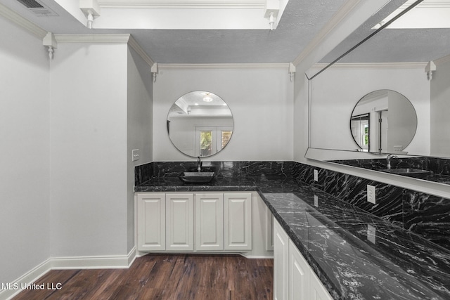 125 Lakeview Dr, Canton, MS 39046 - bathroom featuring wood finished floors, ornamental molding, and vanity