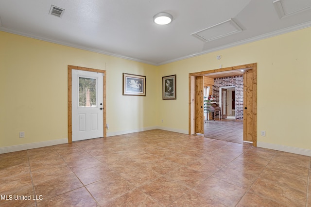 tiled empty room featuring crown molding