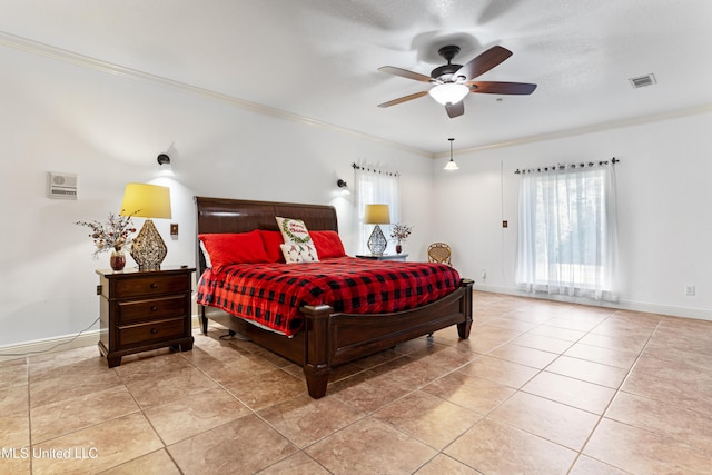 tiled bedroom featuring ceiling fan, ornamental molding, and a textured ceiling