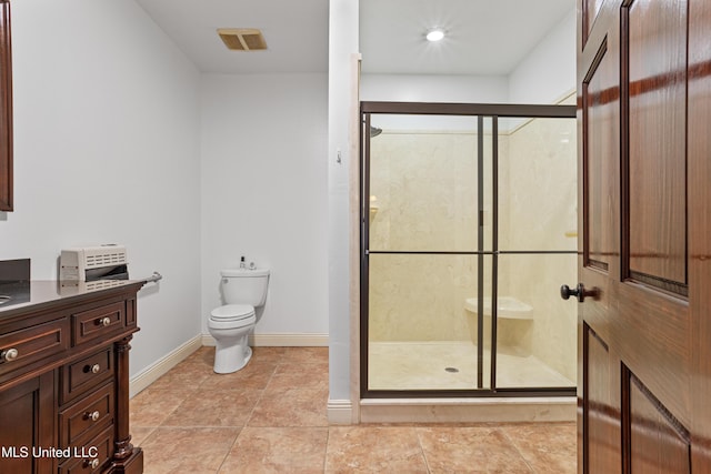 bathroom with vanity, an enclosed shower, and toilet