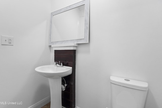 bathroom with toilet and sink