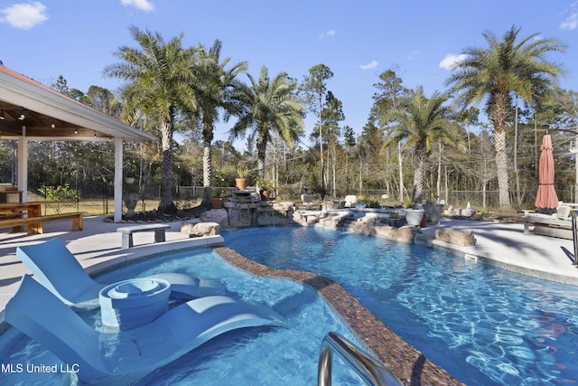 view of swimming pool featuring a patio