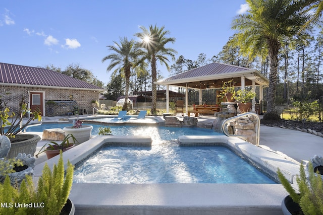 view of pool with a gazebo, a patio area, and a jacuzzi