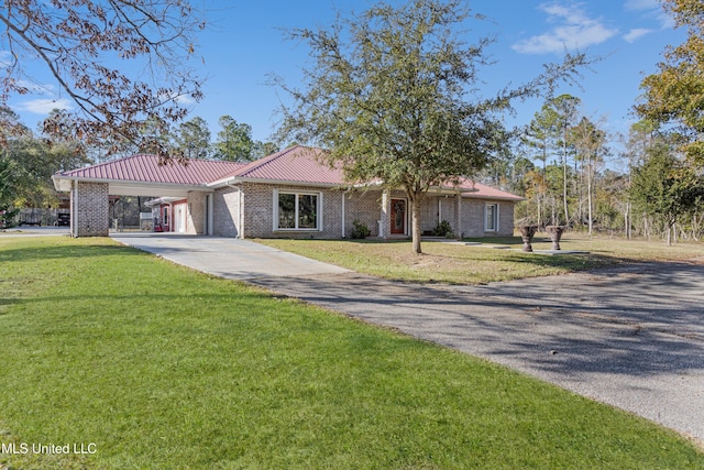 ranch-style home featuring a front yard and a carport