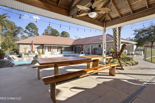 view of patio featuring a gazebo, ceiling fan, and a fenced in pool