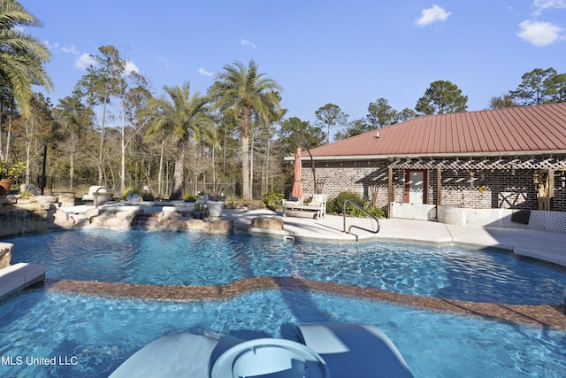 view of swimming pool featuring a patio