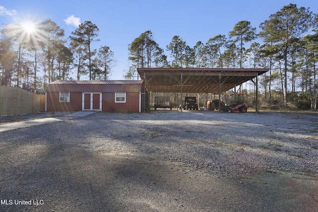 exterior space with a carport