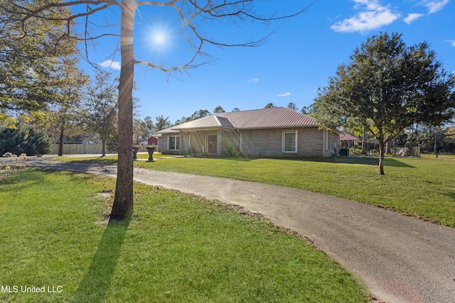 view of home's exterior with a yard