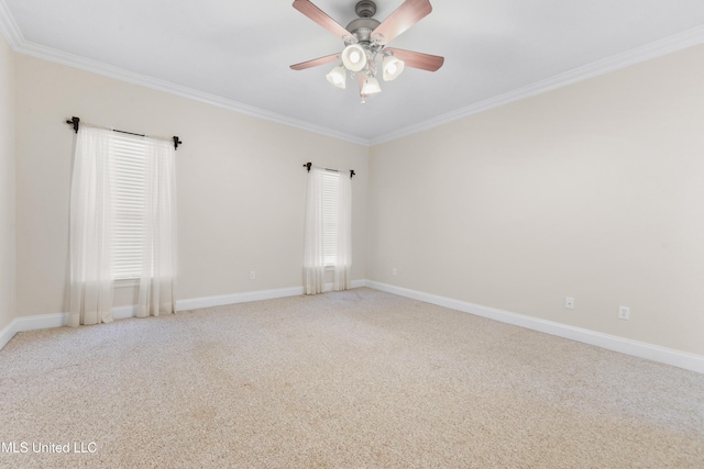 carpeted empty room with ceiling fan and ornamental molding