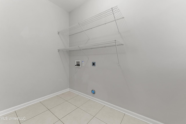 laundry room with light tile patterned floors, hookup for a washing machine, and electric dryer hookup