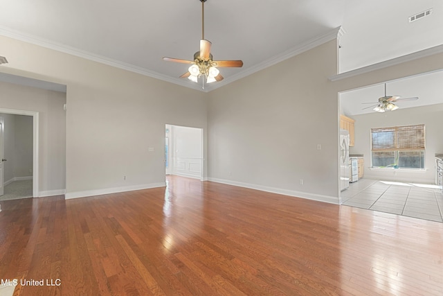 unfurnished living room with ceiling fan, light hardwood / wood-style flooring, and crown molding