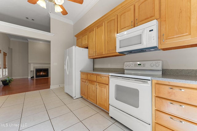 kitchen with ceiling fan, light tile patterned flooring, crown molding, and white appliances