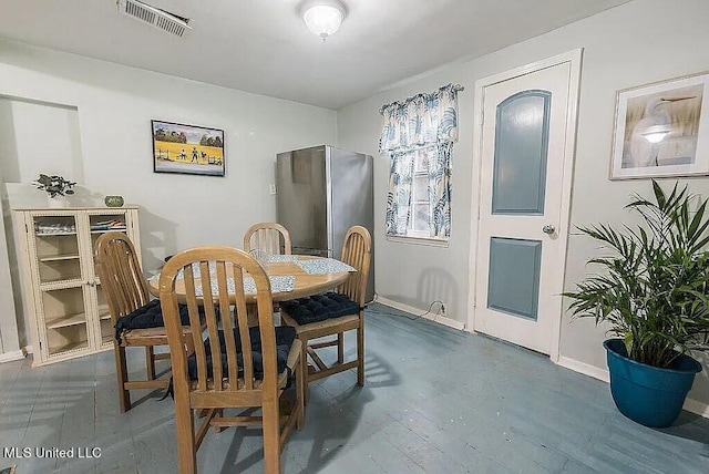 dining area with dark hardwood / wood-style floors