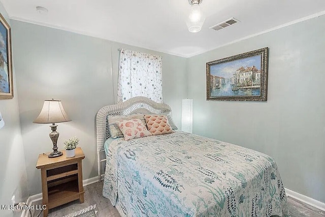 bedroom featuring hardwood / wood-style flooring