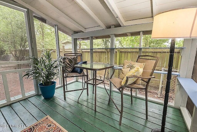 sunroom / solarium with beamed ceiling