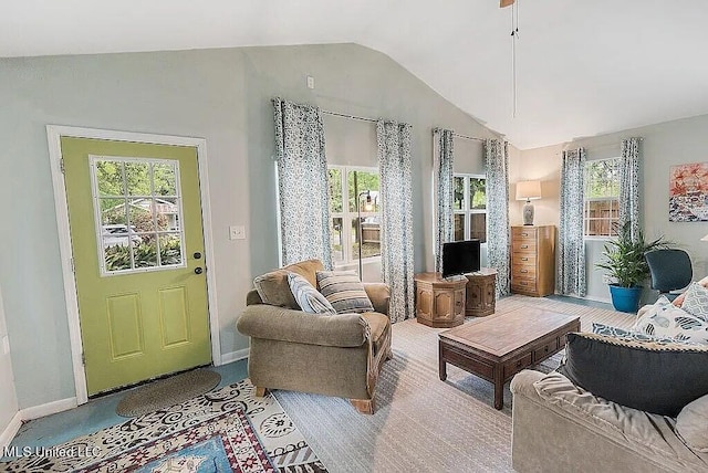 sitting room with lofted ceiling and carpet floors