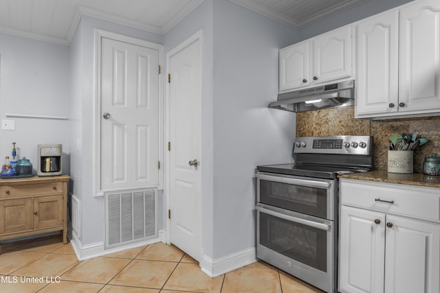 9000 Spring Ave, Ocean Springs, MS 39564 - kitchen featuring visible vents, light tile patterned flooring, under cabinet range hood, tasteful backsplash, and double oven range