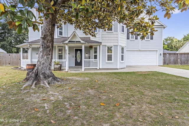 9000 Spring Ave, Ocean Springs, MS 39564 - view of front facade featuring fence, covered porch, a front yard, an attached garage, and driveway
