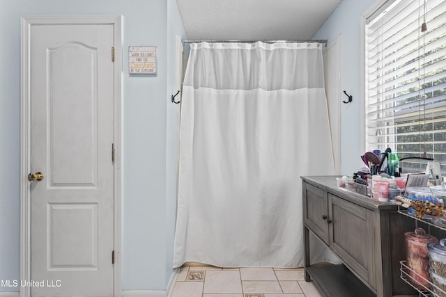 9000 Spring Ave, Ocean Springs, MS 39564 - bathroom with tile patterned floors, vanity, and curtained shower