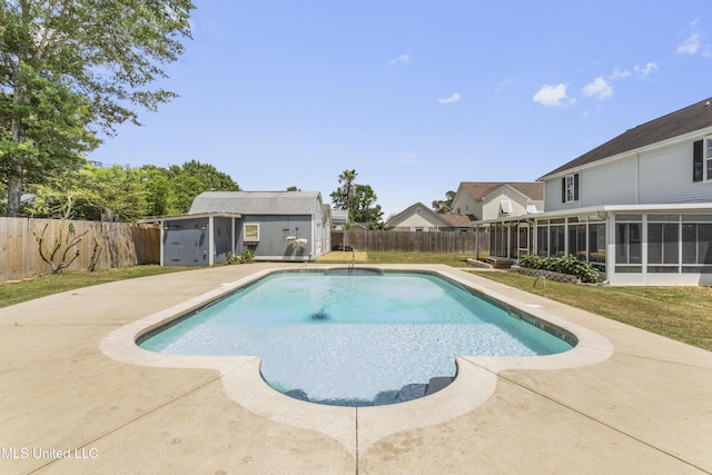 9000 Spring Ave, Ocean Springs, MS 39564 - view of pool featuring a fenced backyard, an outbuilding, a fenced in pool, and a sunroom