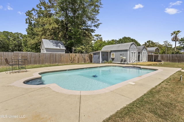 9000 Spring Ave, Ocean Springs, MS 39564 - view of pool featuring a storage shed, a fenced in pool, a fenced backyard, an outbuilding, and a patio area
