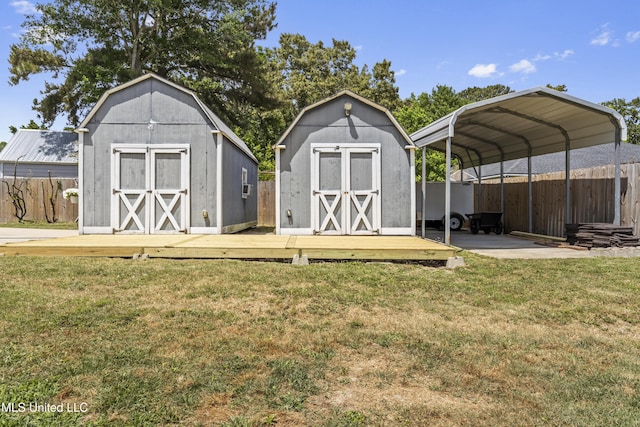 9000 Spring Ave, Ocean Springs, MS 39564 - view of shed featuring fence and a carport