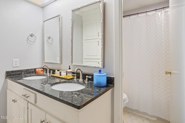 5348 Saratoga Dr, Jackson, MS 39211 - bathroom featuring double vanity, toilet, tile patterned flooring, and curtained shower