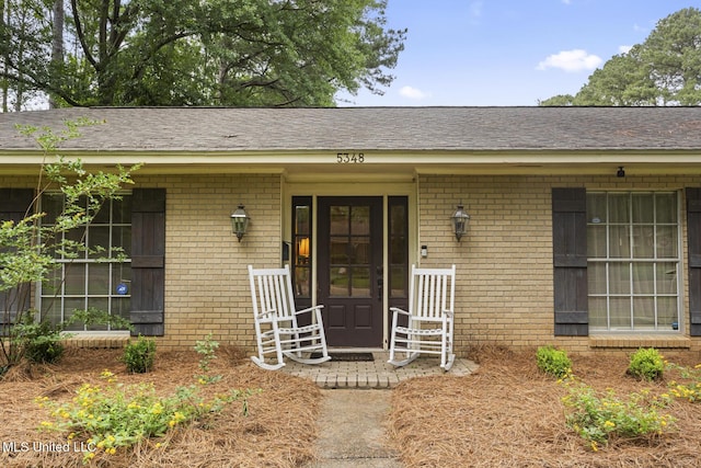 5348 Saratoga Dr, Jackson, MS 39211 - doorway to property featuring brick siding and covered porch
