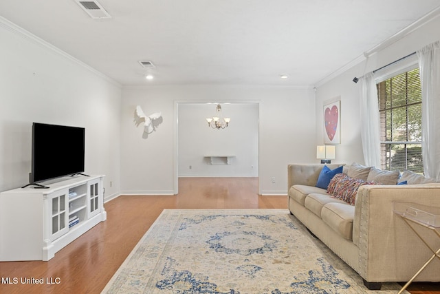5348 Saratoga Dr, Jackson, MS 39211 - living room with wood finished floors, a chandelier, ornamental molding, baseboards, and recessed lighting