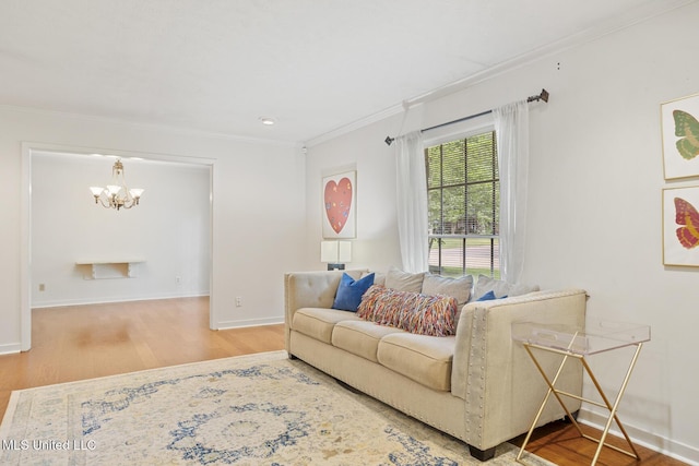 5348 Saratoga Dr, Jackson, MS 39211 - living room with a chandelier, crown molding, wood finished floors, and baseboards