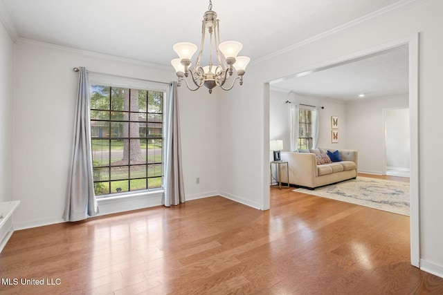 5348 Saratoga Dr, Jackson, MS 39211 - living room with a chandelier, wood finished floors, crown molding, and baseboards
