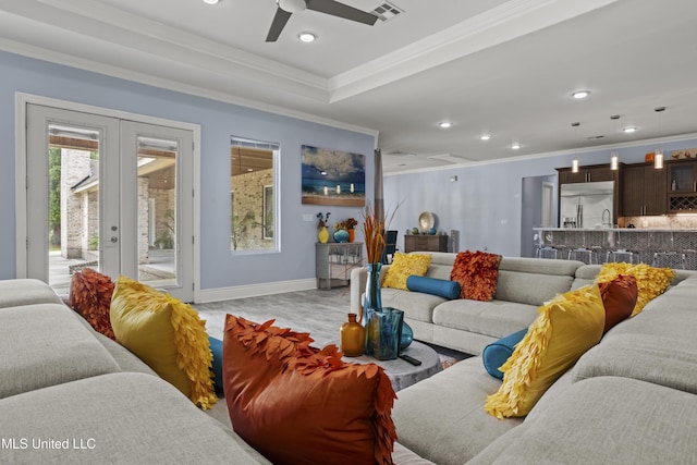 living room featuring french doors, recessed lighting, a ceiling fan, light wood-style floors, and ornamental molding