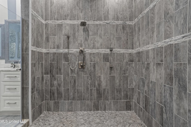 full bath featuring a tile shower