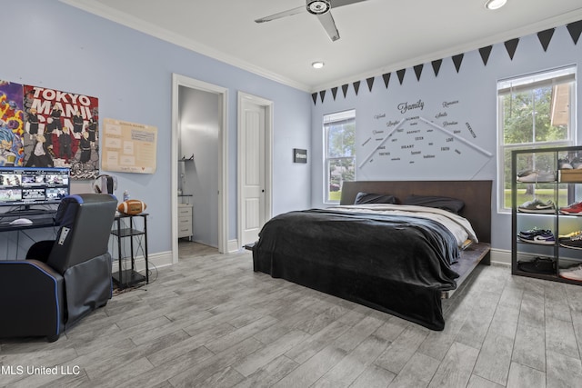 bedroom with crown molding, wood finished floors, multiple windows, ceiling fan, and baseboards