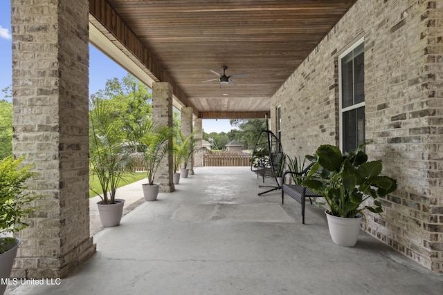 view of patio / terrace featuring a ceiling fan and fence