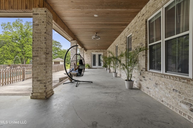 view of patio / terrace with french doors and fence