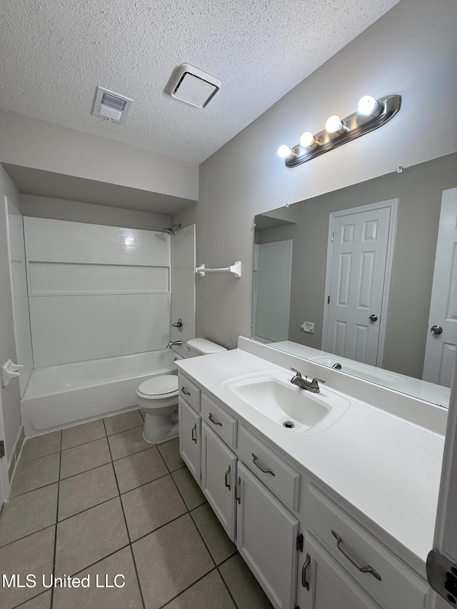 7120 Oak Forest Dr, Olive Branch, MS 38654 - bathroom featuring vanity, tile patterned flooring,  shower combination, and a textured ceiling