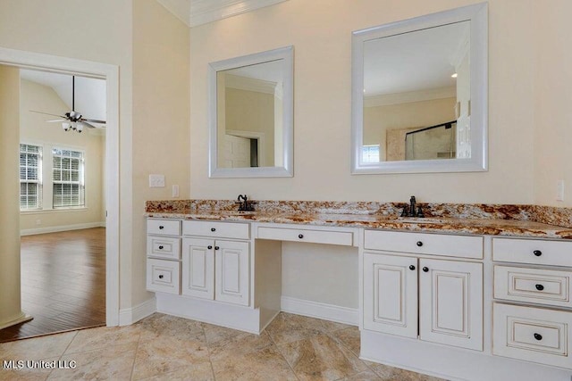 bathroom featuring vanity, ornamental molding, wood-type flooring, and ceiling fan