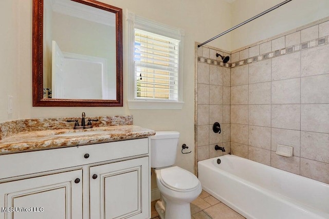 full bathroom featuring vanity, toilet, tile patterned floors, and tiled shower / bath