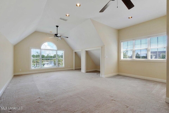 bonus room with light carpet, ceiling fan, and vaulted ceiling