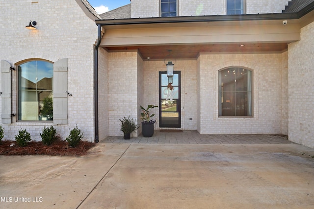 property entrance with a patio