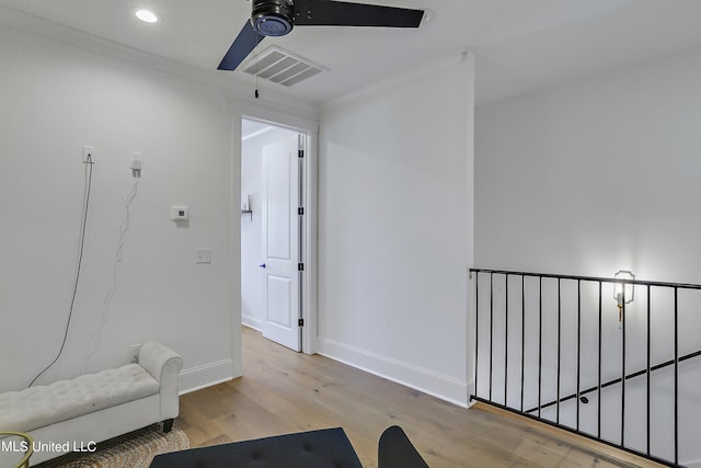 sitting room featuring ceiling fan and light wood-type flooring