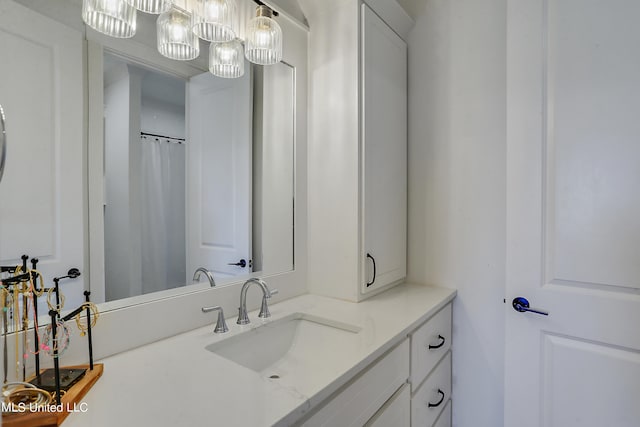 bathroom featuring vanity and walk in shower