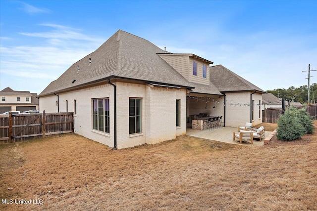 rear view of house with a patio area