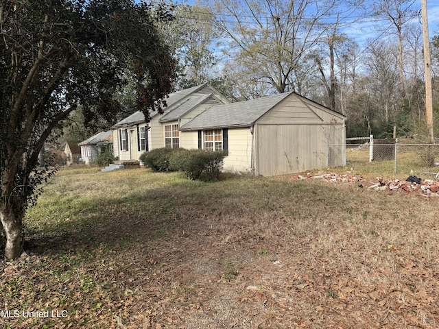 view of property exterior with a lawn