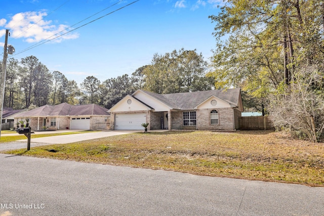 ranch-style house featuring a garage and a front lawn