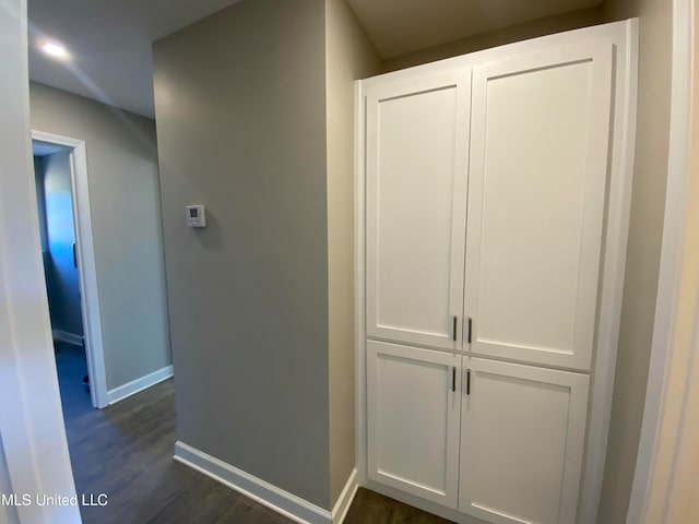 hall with dark hardwood / wood-style floors