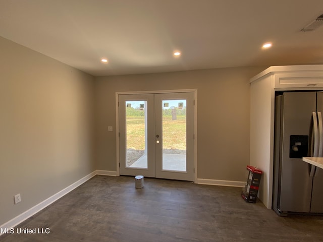 doorway featuring french doors and dark wood-type flooring