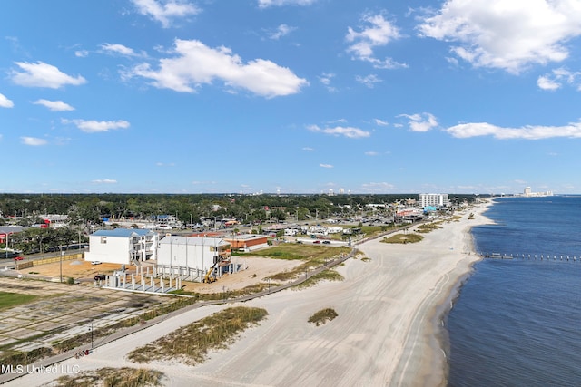 bird's eye view featuring a water view and a beach view